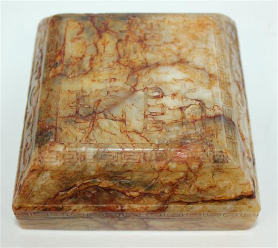 A Chinese archaistic stained and waxed bowenite jade scholars scroll weight, 11cm